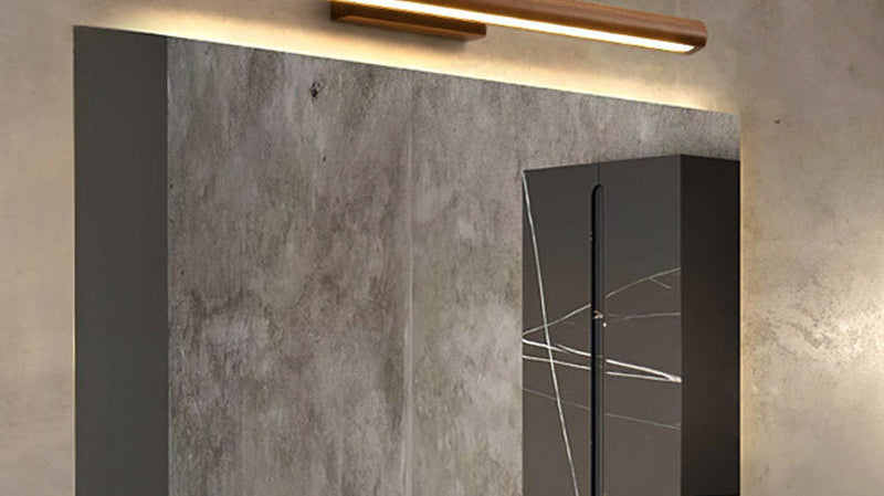 Nordic linear LED vanity light in dark wood above a bathroom mirror
