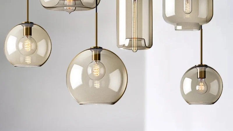 Nordic glass LED pendant lights hanging over a kitchen island