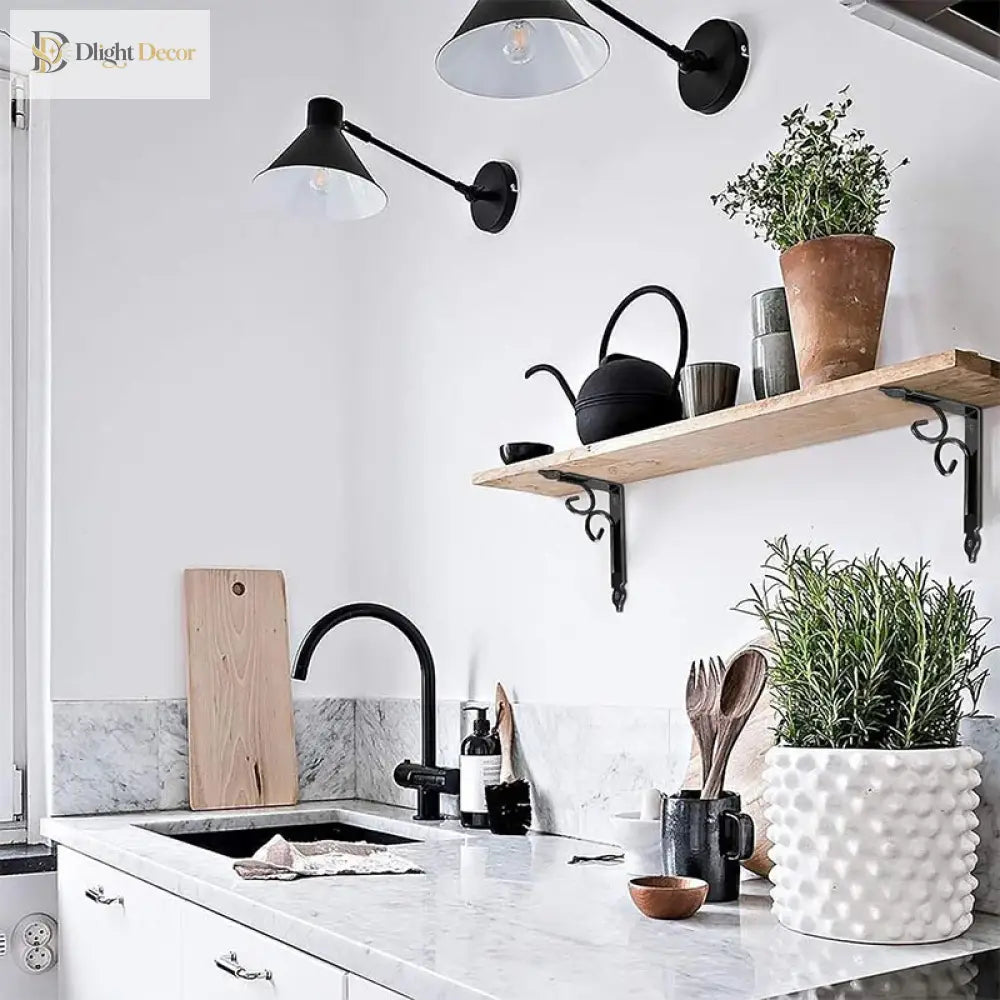 Decorative black shelf wall bracket with curved scroll arms holding a wooden shelf