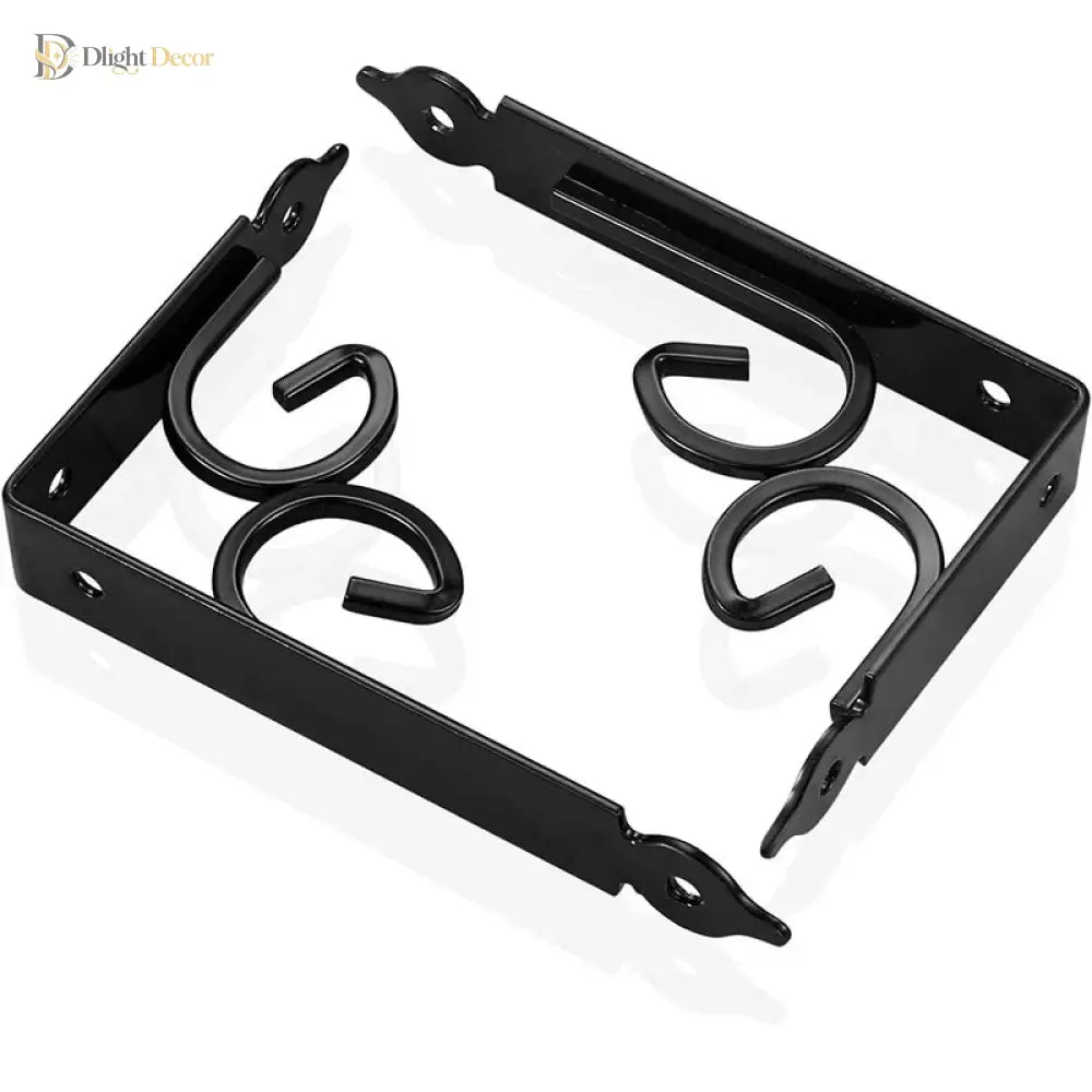 Set of four black metal shelf brackets with decorative scroll arms and screw holes