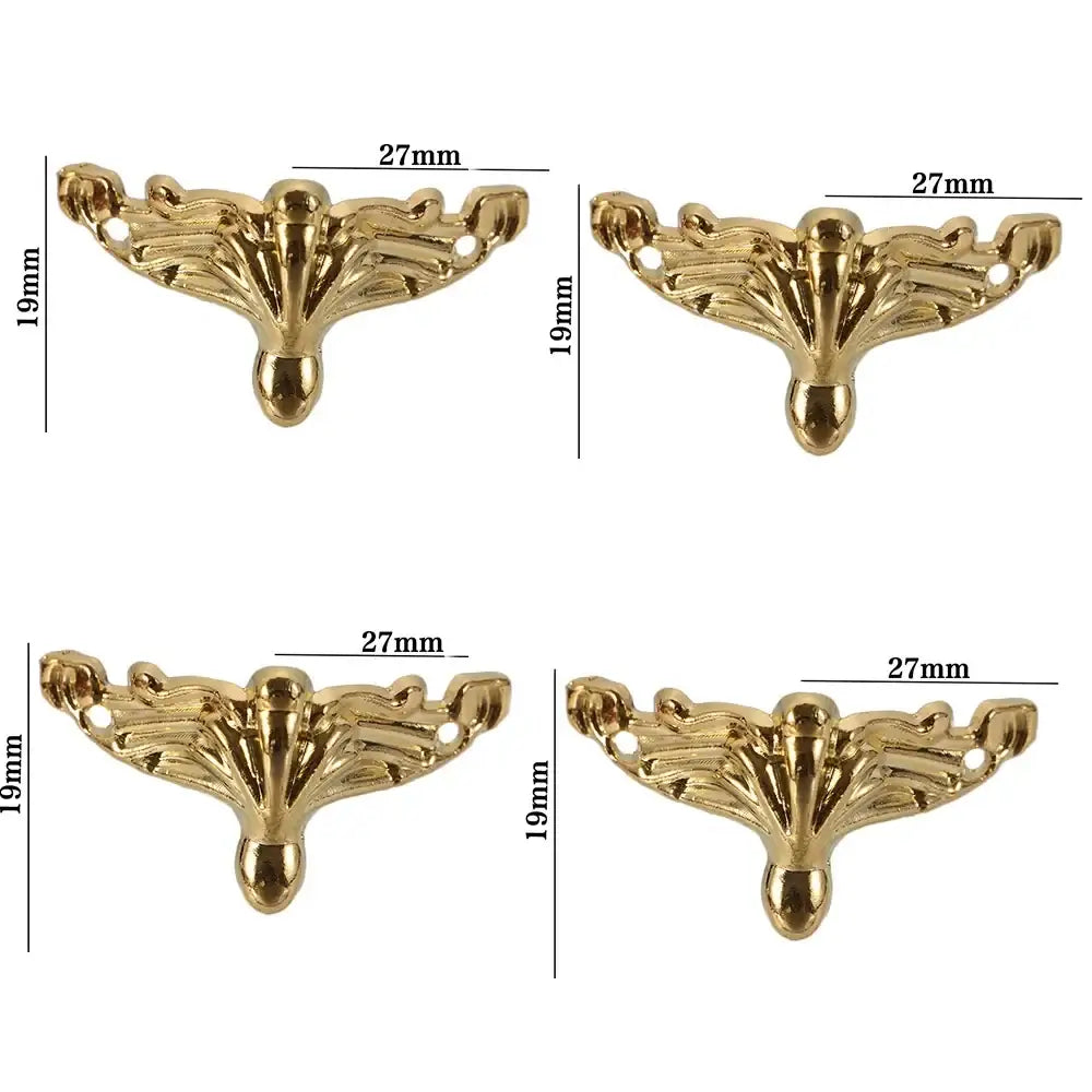Set of four antique bronze box corner feet with decorative leaf scroll design