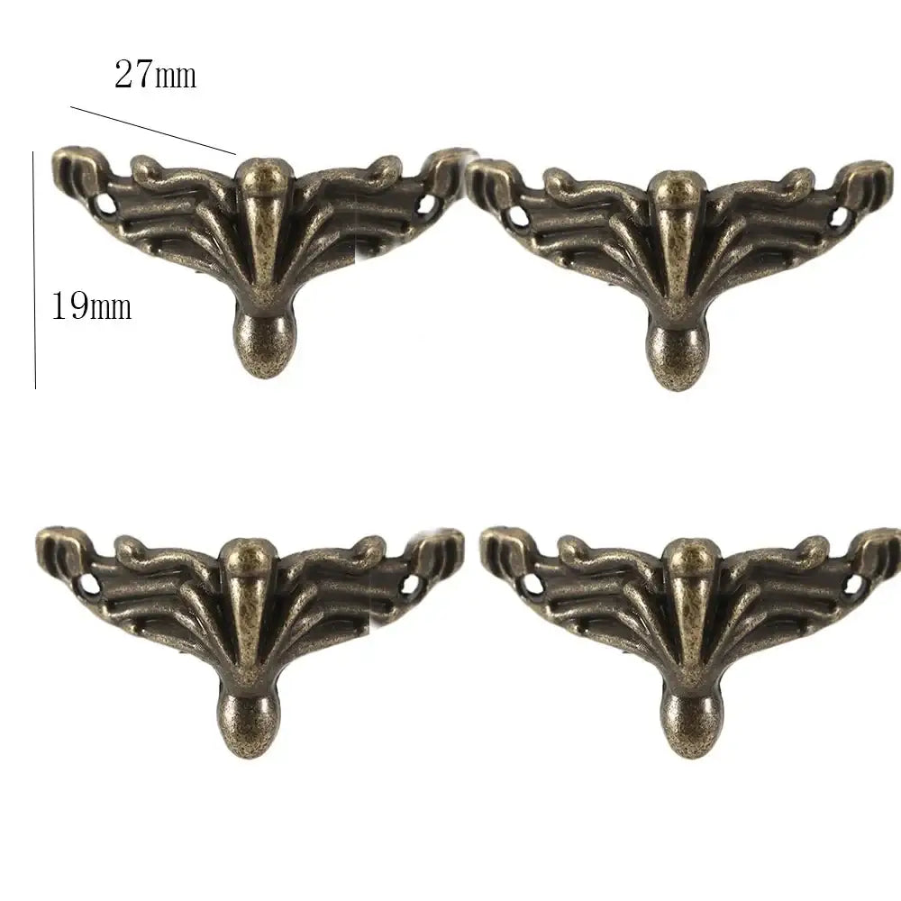 Four antique bronze corner feet with leaf fan detailing and mounting hole points