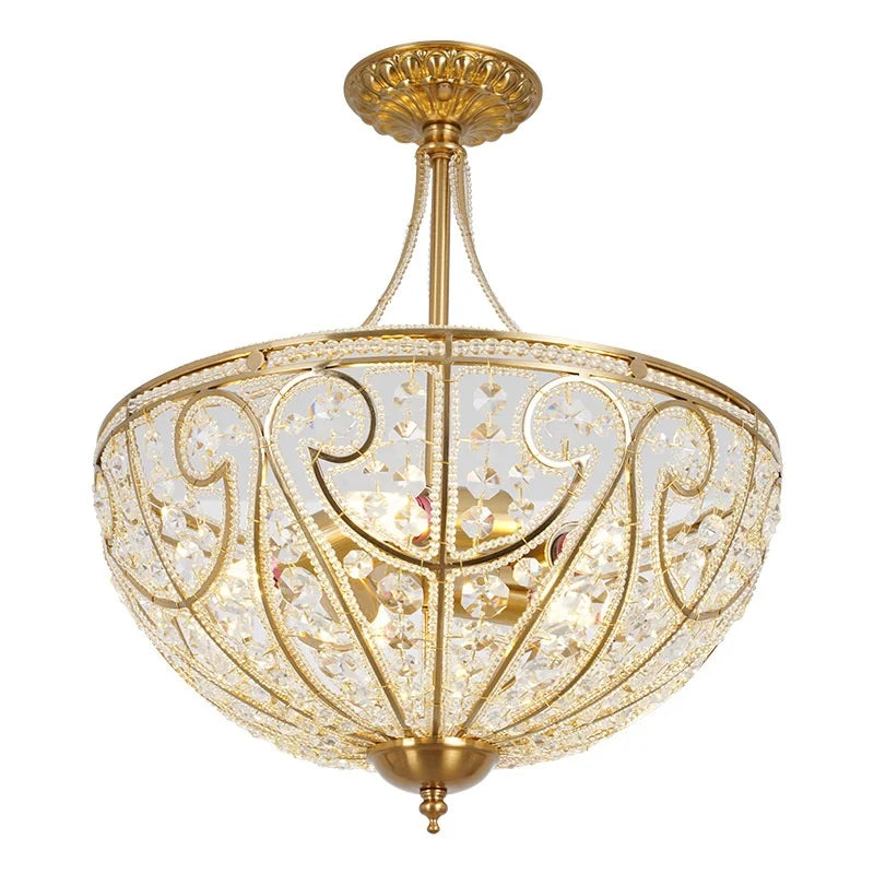Gold-tone flush-mount chandelier close-up with crystal-style cutouts and ornate filigree pattern
