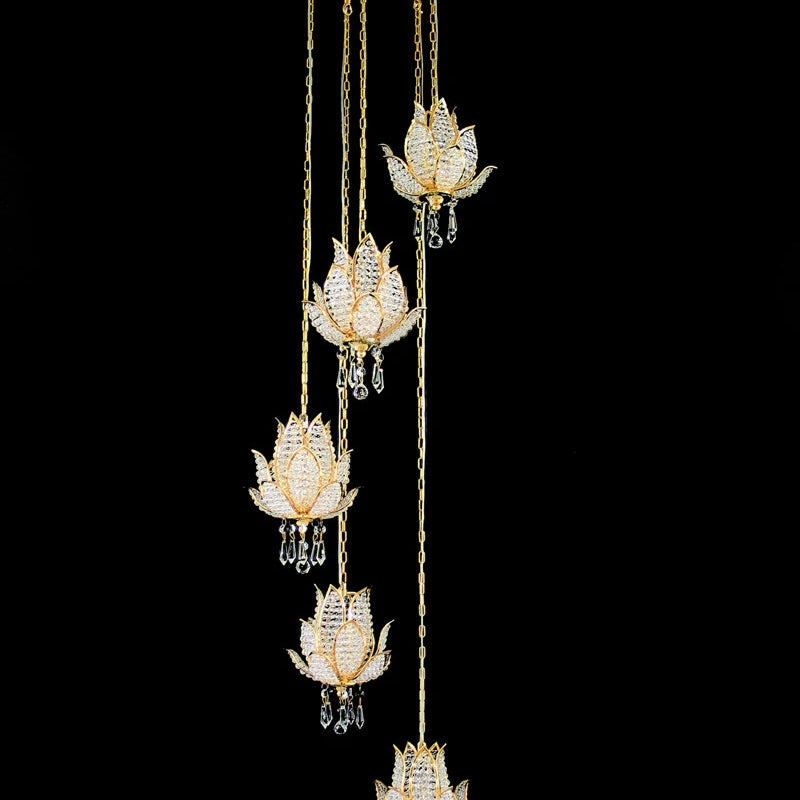 Hanging gold crystal chandelier set with multiple lotus-shaped light fixtures