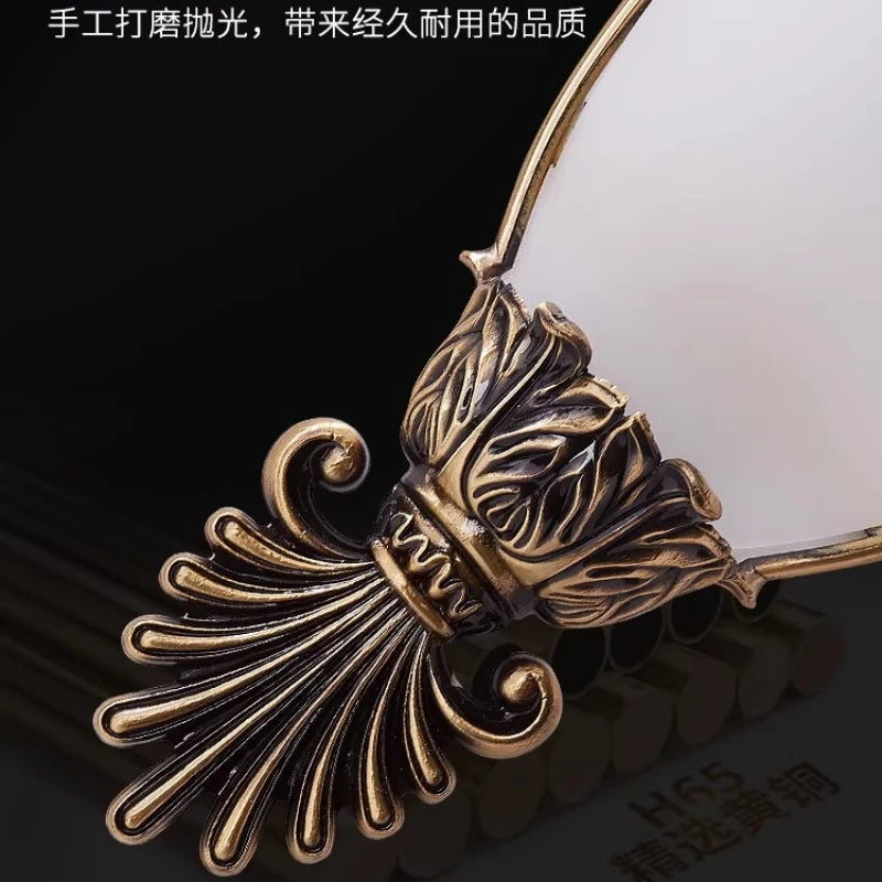Decorative gold metal leaf and scroll detail for vintage wall sconce
