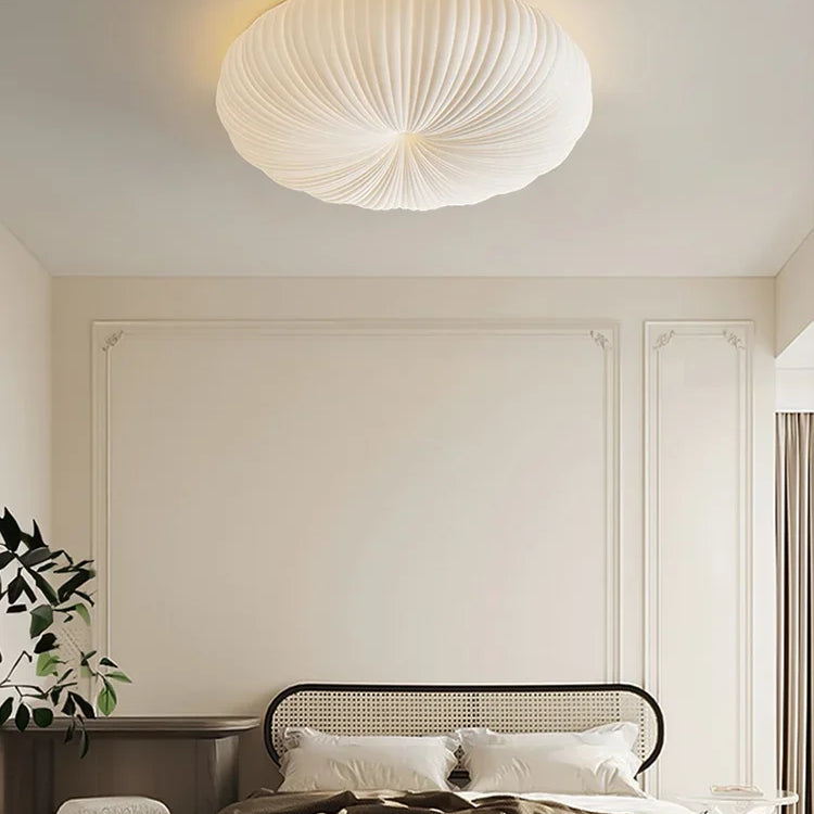 Cream fabric round ceiling light with ribbed shade, flush-mount style