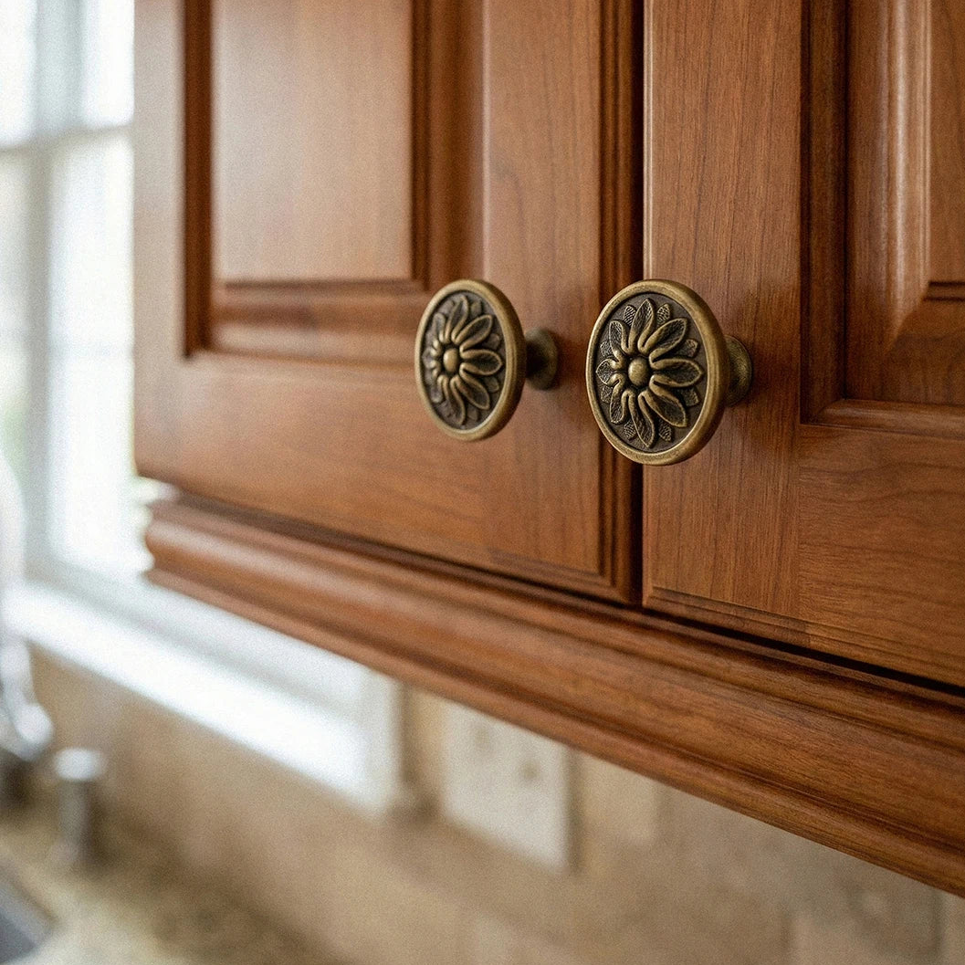 Wooden cabinet with brass flower-shaped knobs and 'Santaya' branding.
