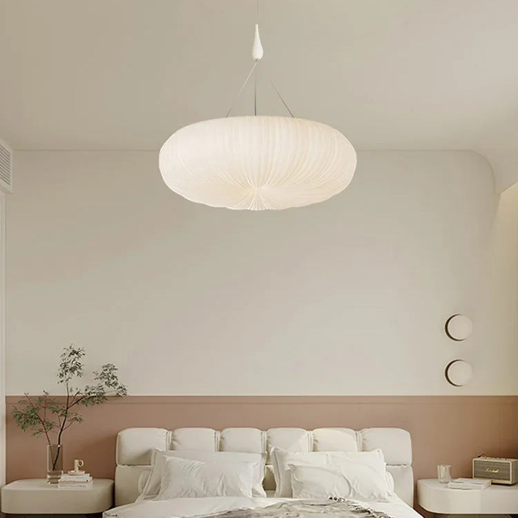 Cream fabric pendant ceiling light with ribbed globe shade and hanging cord