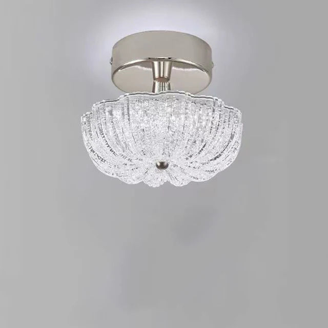 Chrome flush-mount ceiling light with clear crystal-style acrylic drum shade
