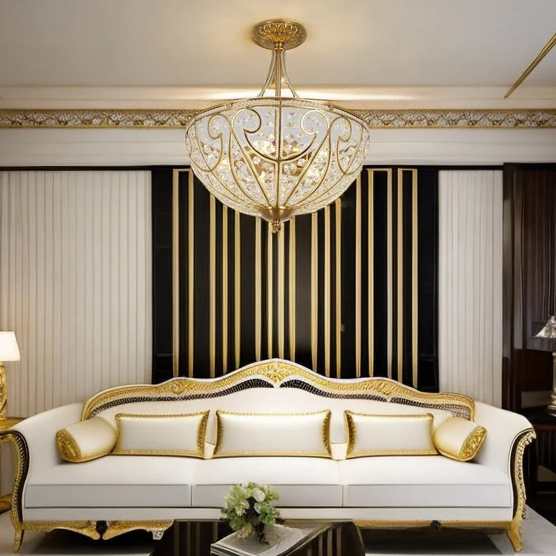 Gold-tone flush-mount chandelier with crystal-style accents and ornate scrollwork shade