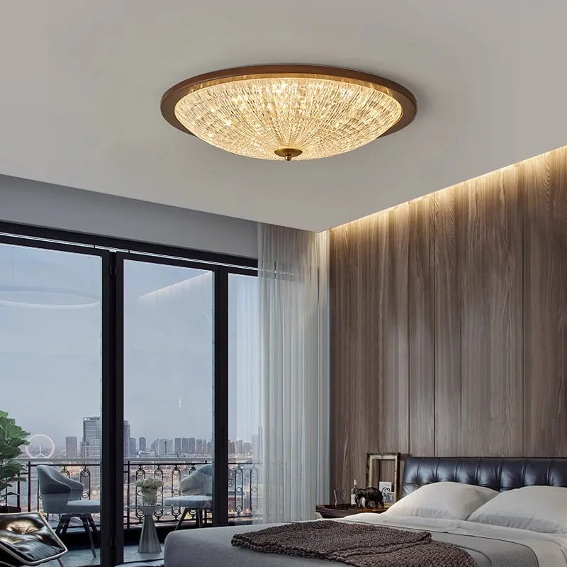 Walnut flush-mount ceiling light with clear ribbed acrylic diffuser and warm glow