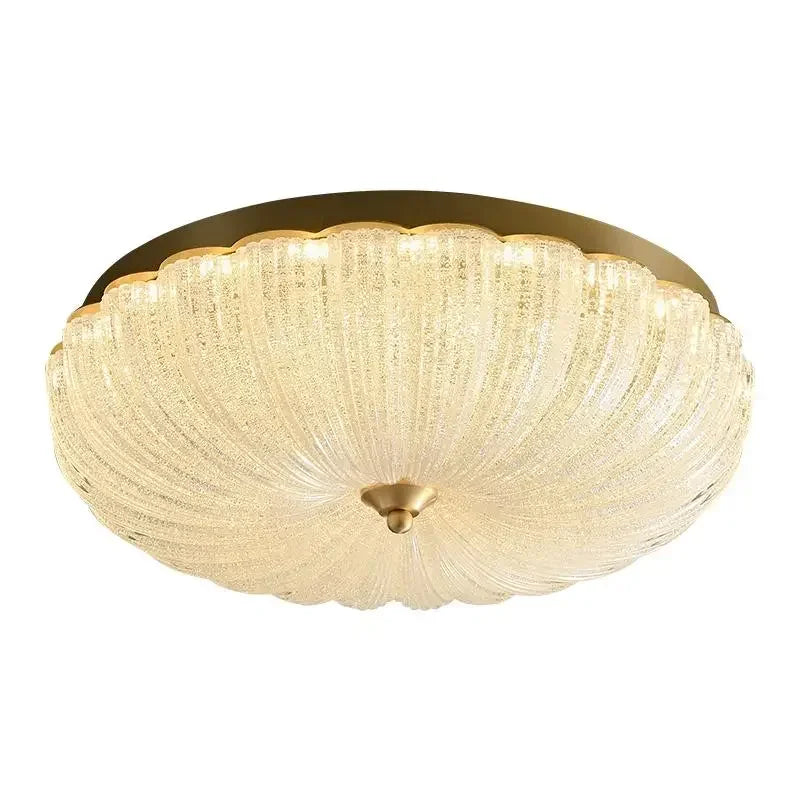 Ivory crystal-style acrylic LED flush-mount ceiling light with scalloped diffuser and brass cap