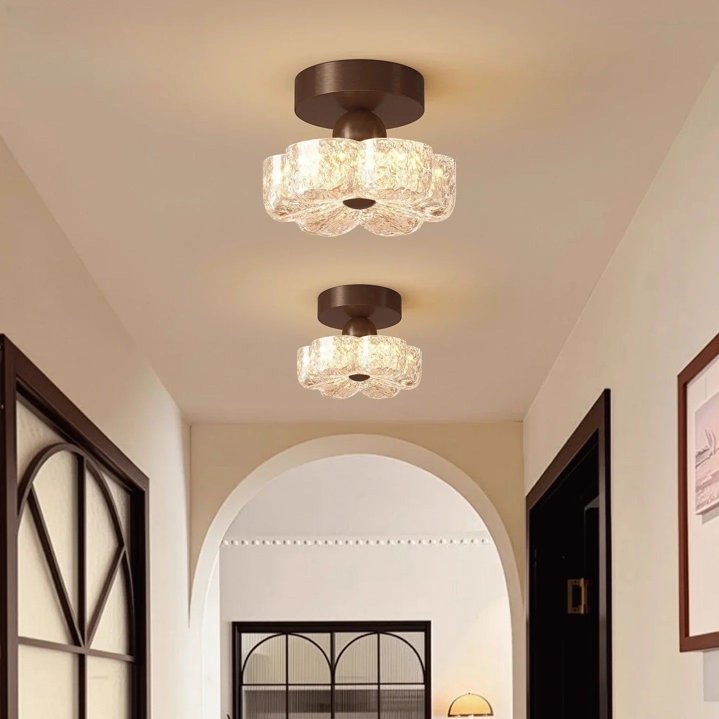 Brown flush-mount LED ceiling light with frosted glass shades on a ceiling