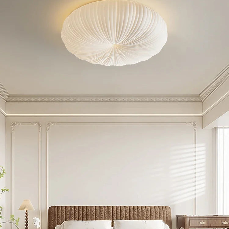 Cream flush-mount ceiling light with ribbed fabric dome shade
