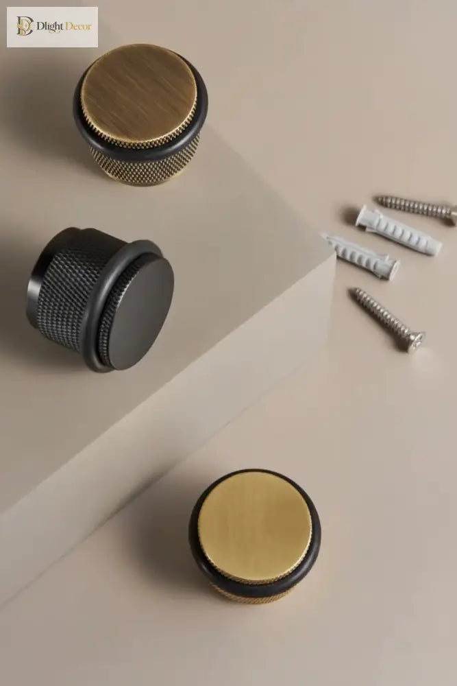 Knurled floor door stop with black body and black ring, plus mounting screws