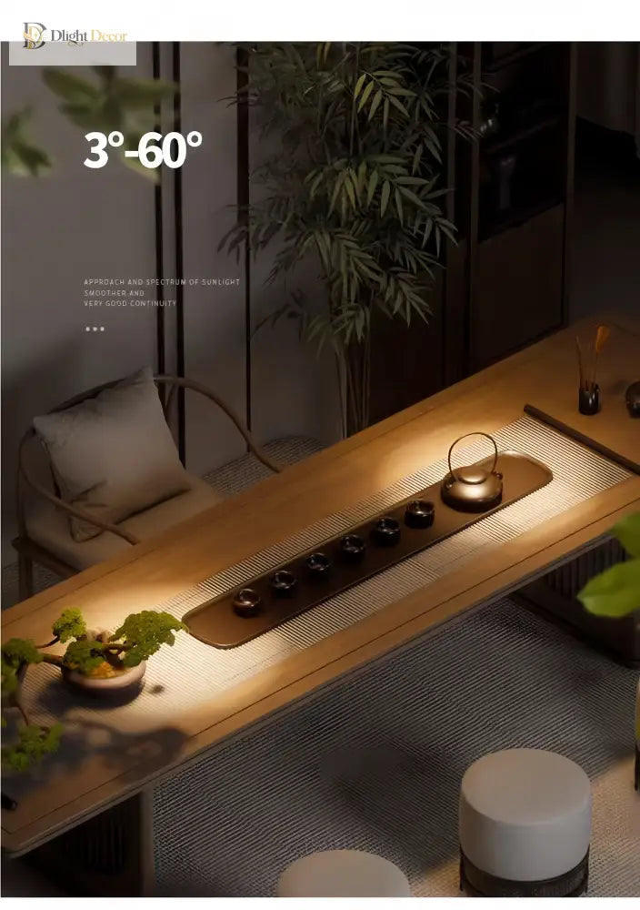 Adjustable LED zoom spotlight projecting a warm beam onto a sofa and rug in a room