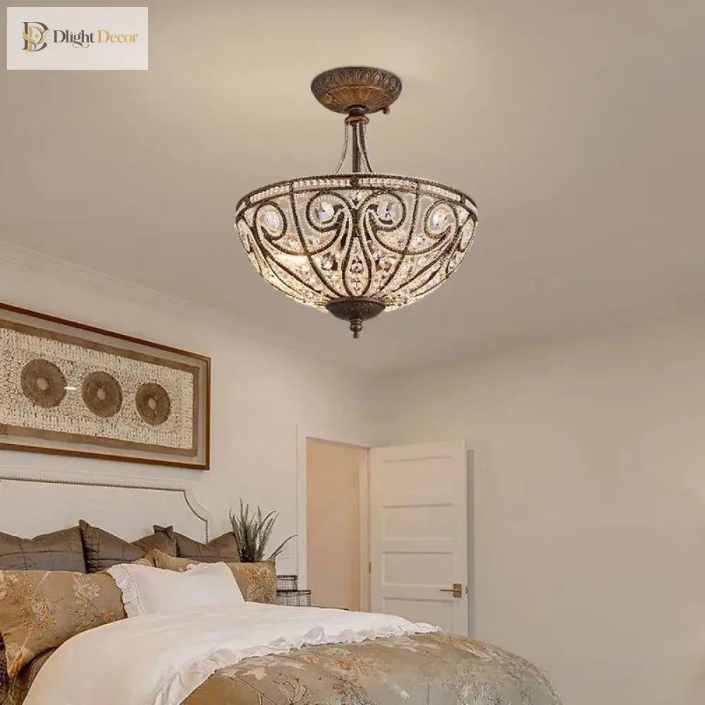 Gold-tone flush-mount ceiling light with crystal-style shade and ornate medallion design