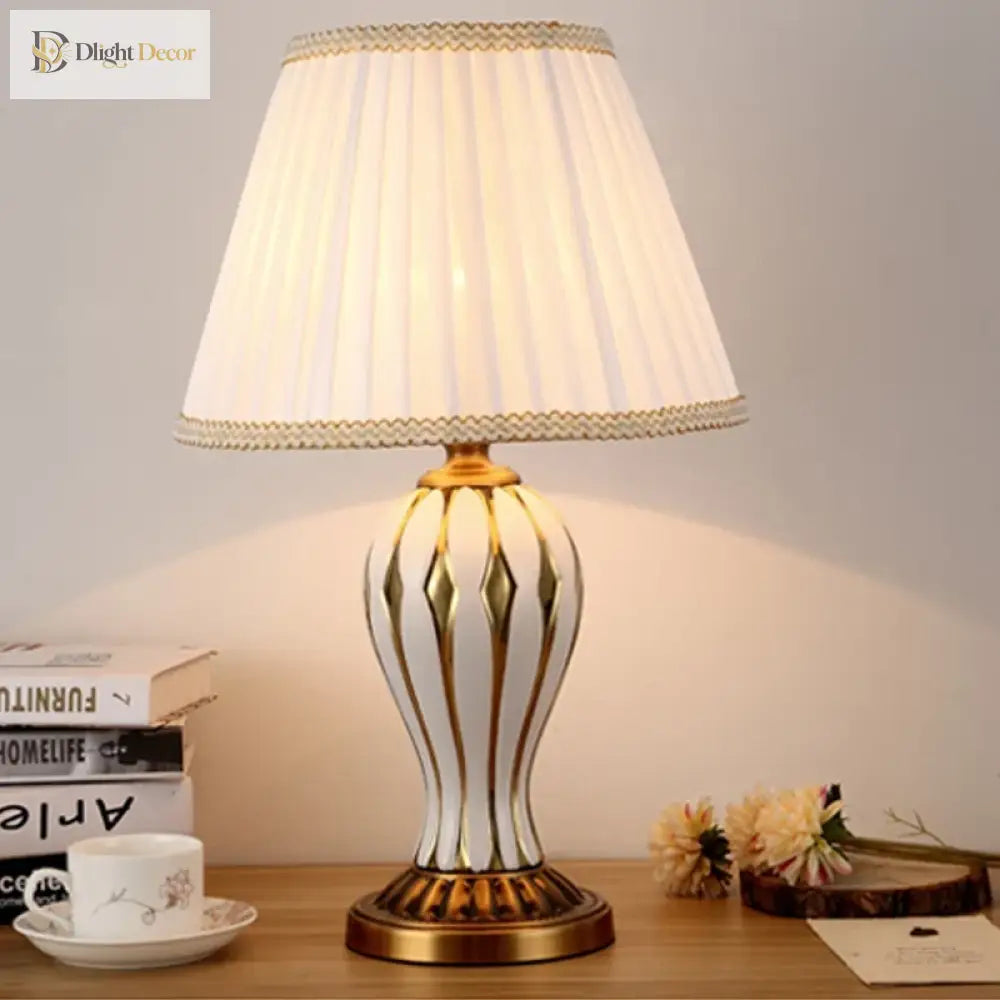 Antique ceramic LED desk lamp with white fabric shade and cream-and-gold base