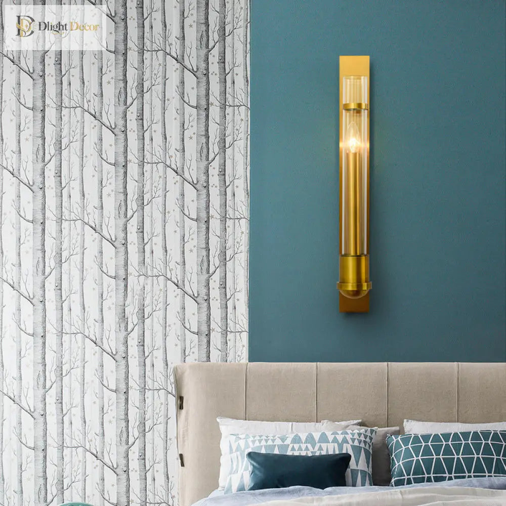 Modern Elegance Meets Warm Illumination: The Clear Glass Wall Sconce