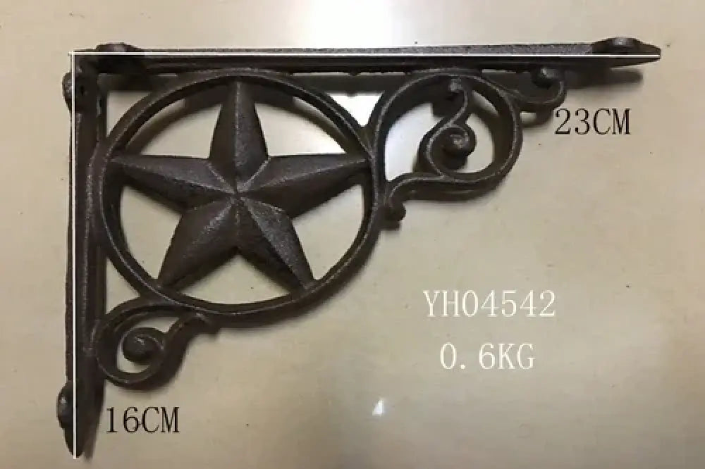 Black cast iron triangle shelf bracket with star medallion and spiral accents