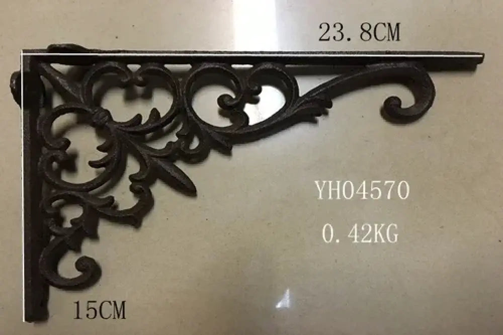 Cast iron right-angle shelf bracket with ornate scroll corner, dark finish