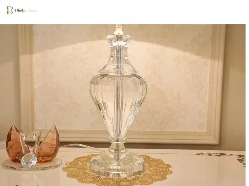 Clear crystal column table lamp with pleated white shade and gold trim