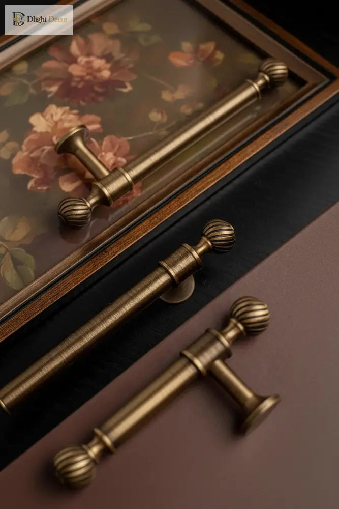 Brushed brass cabinet pull with round ribbed lever ends