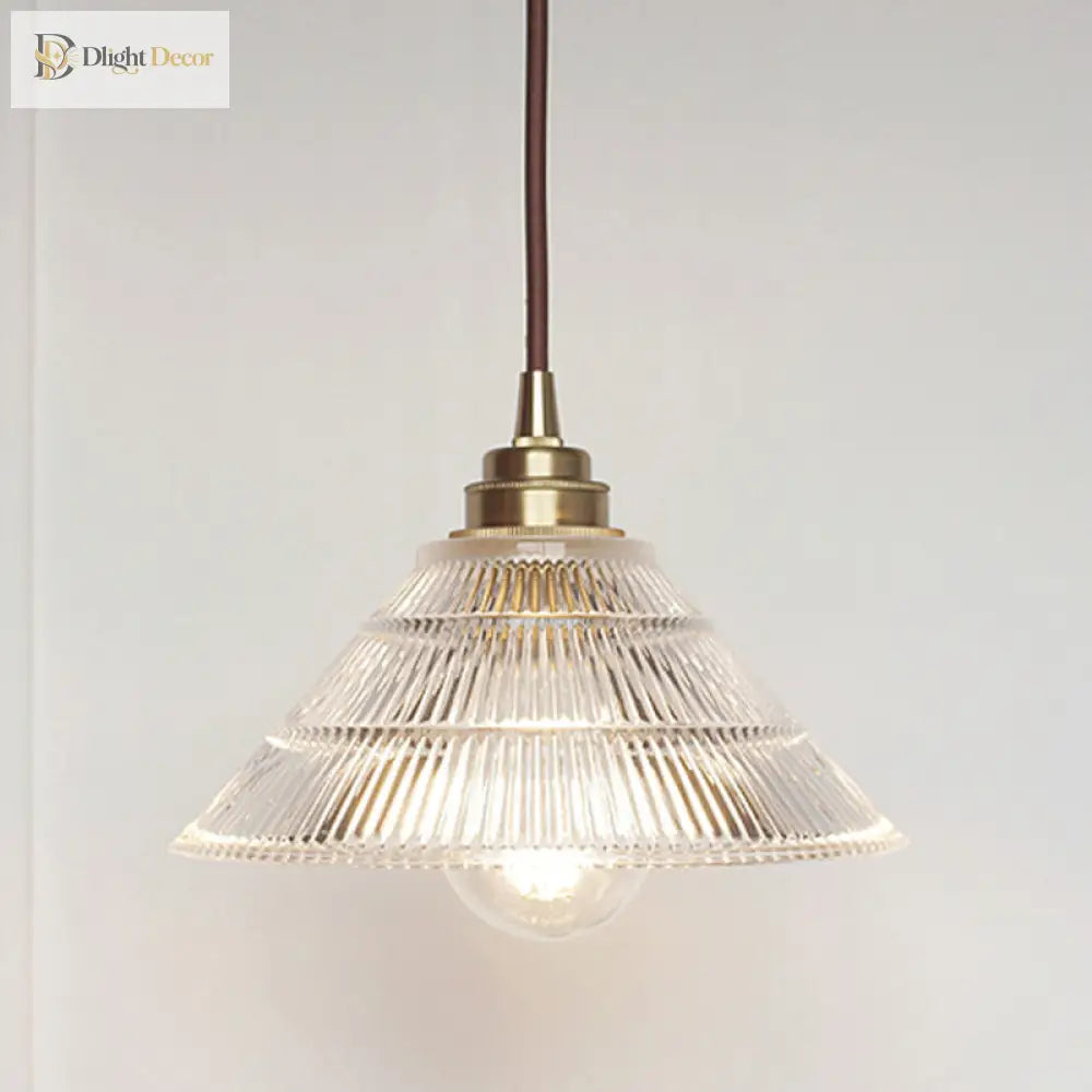 Enhance Your Dining Room With Industrial Elegance: The Brass Cone Pendant Clear Ribbed Glass