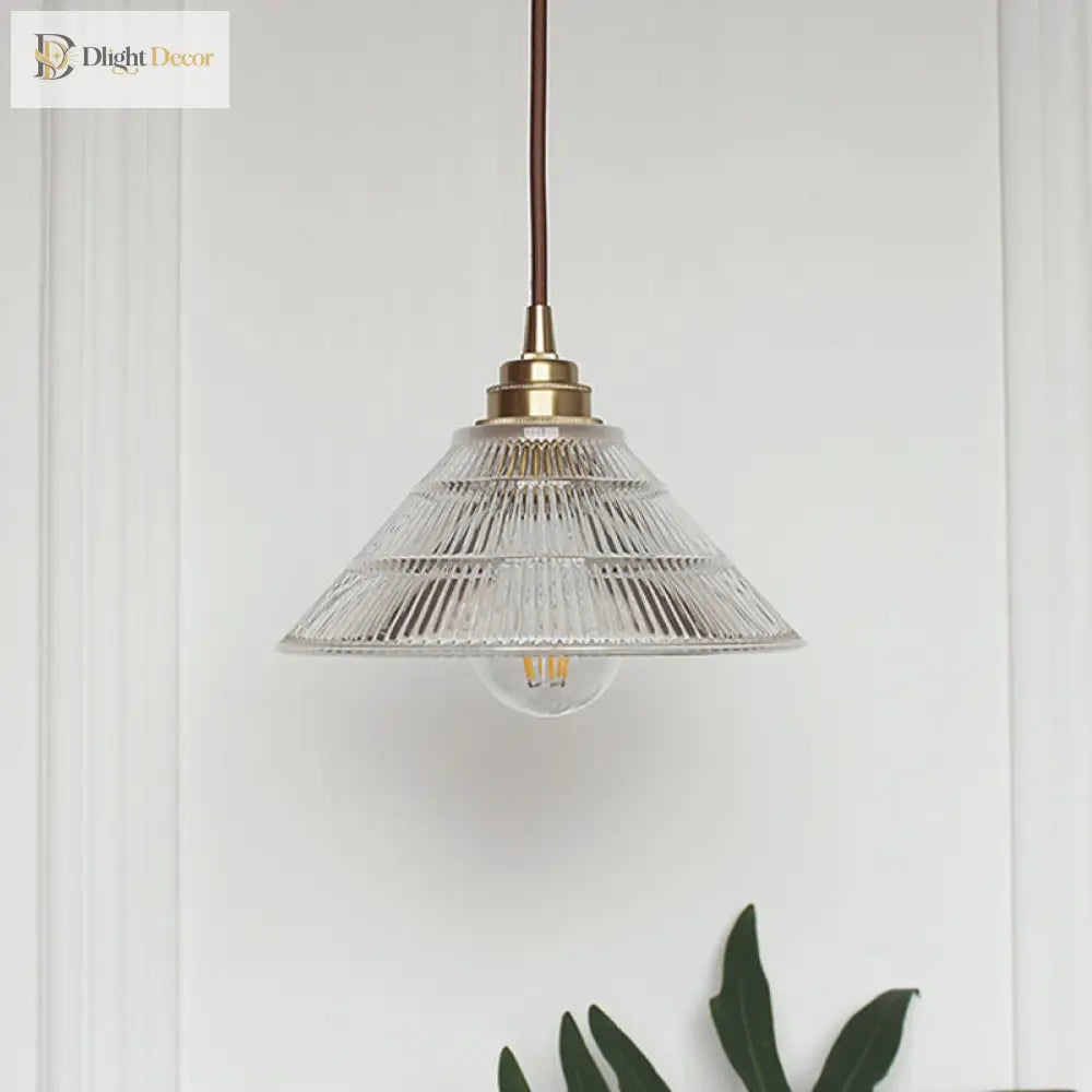 Enhance Your Dining Room With Industrial Elegance: The Brass Cone Pendant Clear Ribbed Glass