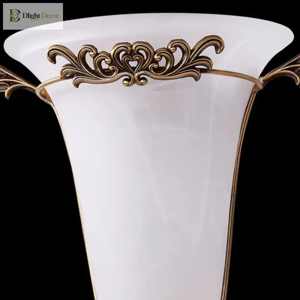Ornate gold wall sconce with frosted glass shade, front view