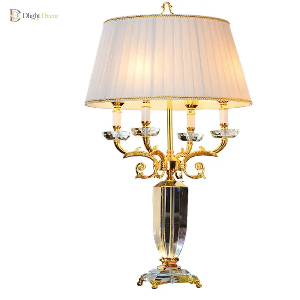 Fabric LED table lamp with pleated cream fabric shade and gold-and-clear candelabra stand