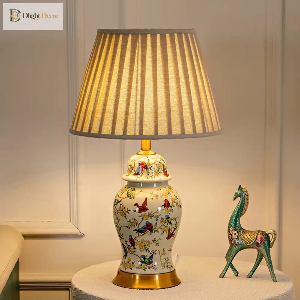 Floral ceramic LED desk lamp with gold base and pleated fabric shade, full view.