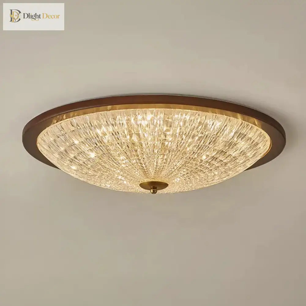 Walnut round flush-mount ceiling light with faceted clear acrylic diffuser, warm illumination
