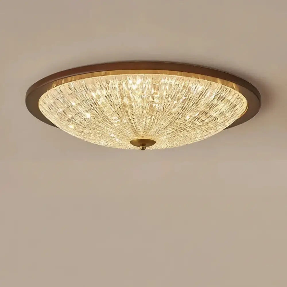 Walnut round flush-mount ceiling light with faceted clear acrylic globe diffuser