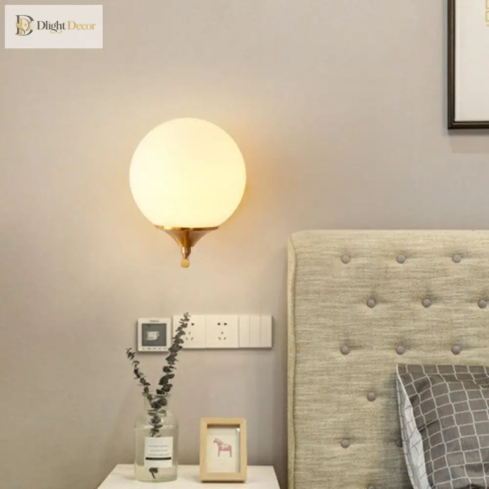 Modern Elegance Meets Warmth: Gold Sphere Bedside Wall Sconce