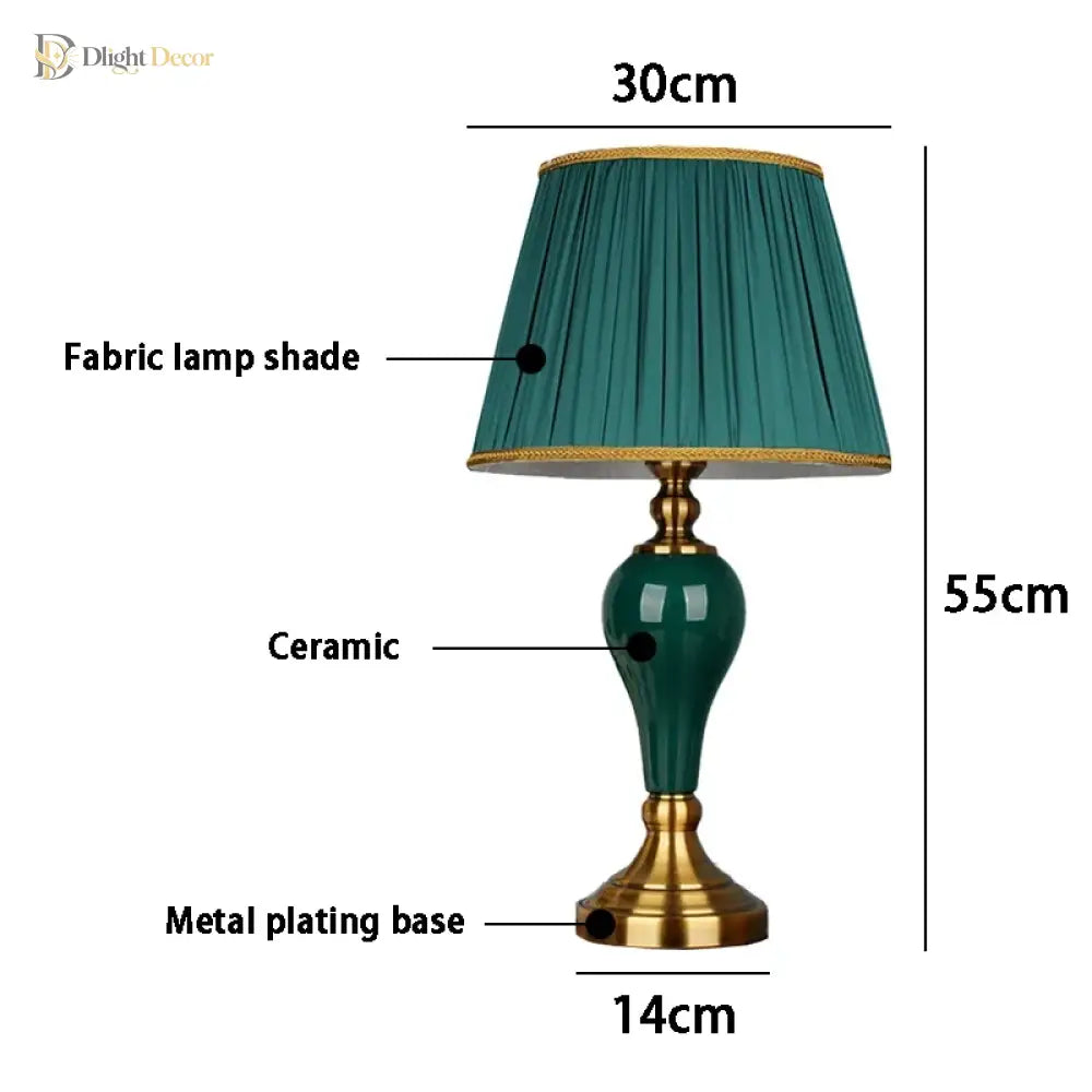 Green ceramic table lamp with pleated teal fabric shade and gold metal plating base