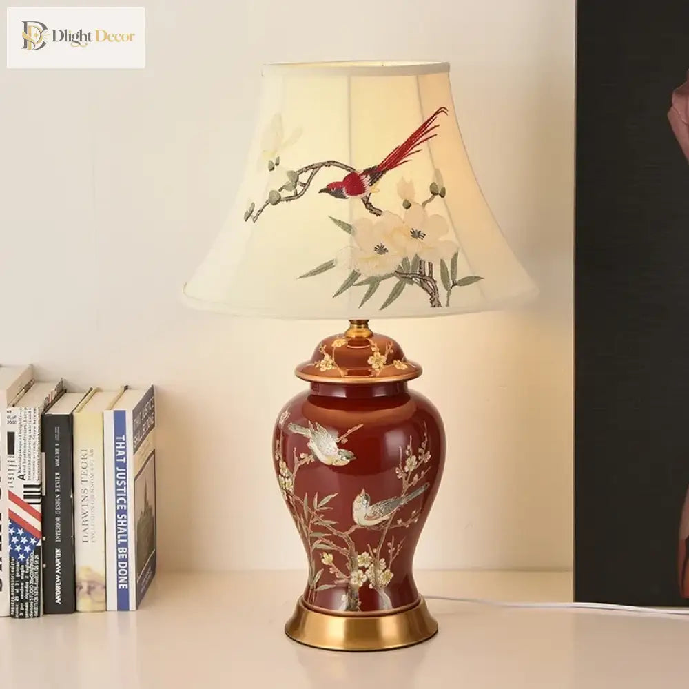 Ceramic LED desk lamp, red ceramic base with gold accents and cream bird-and-flower shade