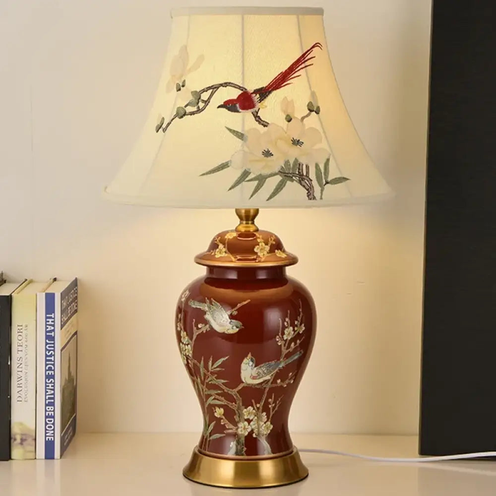 Ceramic LED desk lamp with cream floral shade and red vase body with gold details