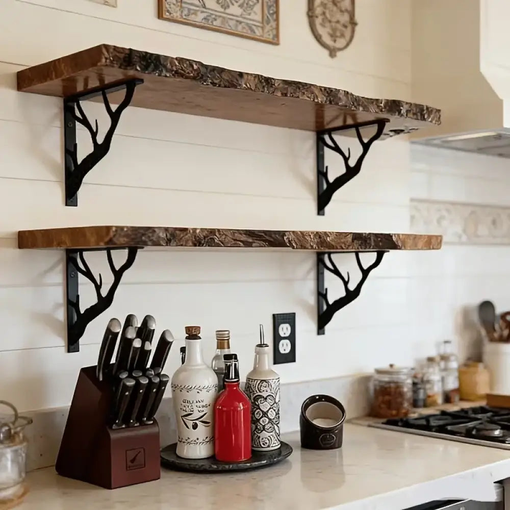 Black metal L-shaped wall bracket with tree-branch cutout, supports a wooden shelf