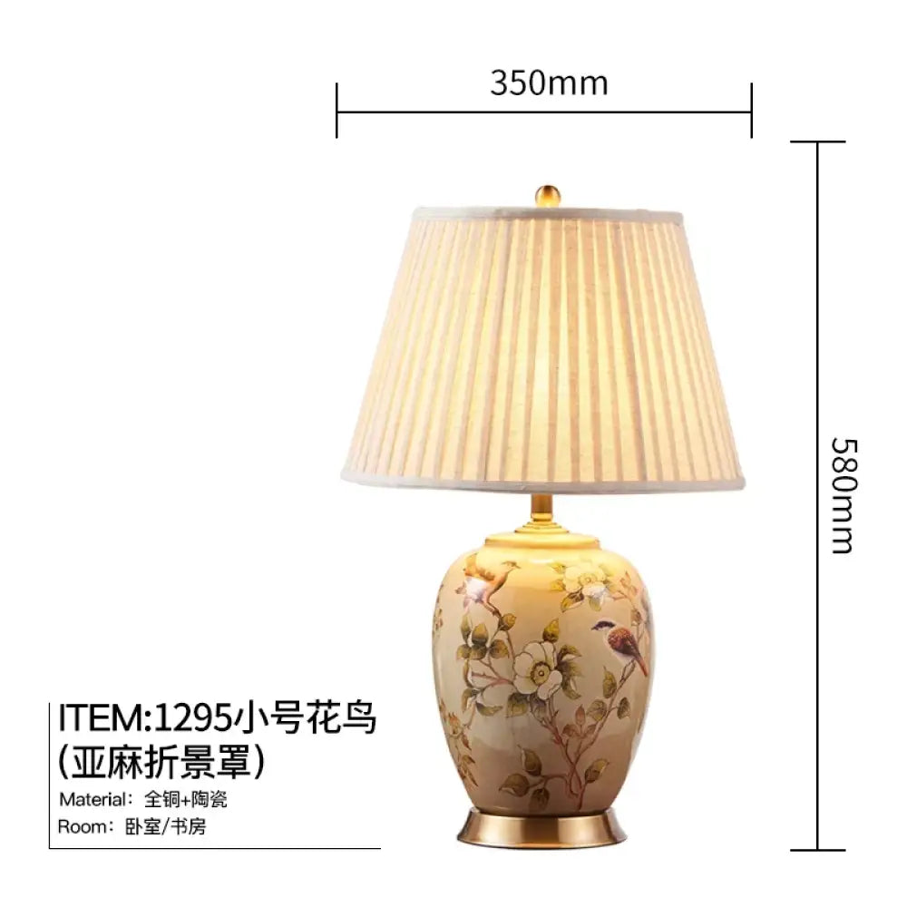 Ceramic LED table lamp with pleated shade and floral bird motif, size dimensions shown