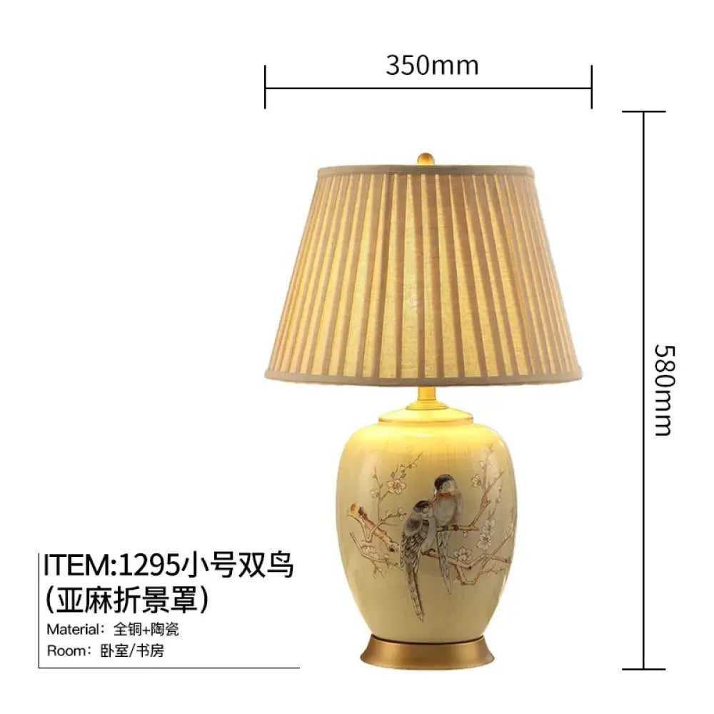 Ceramic table lamp with pleated fabric shade and floral bird artwork, size dimensions shown