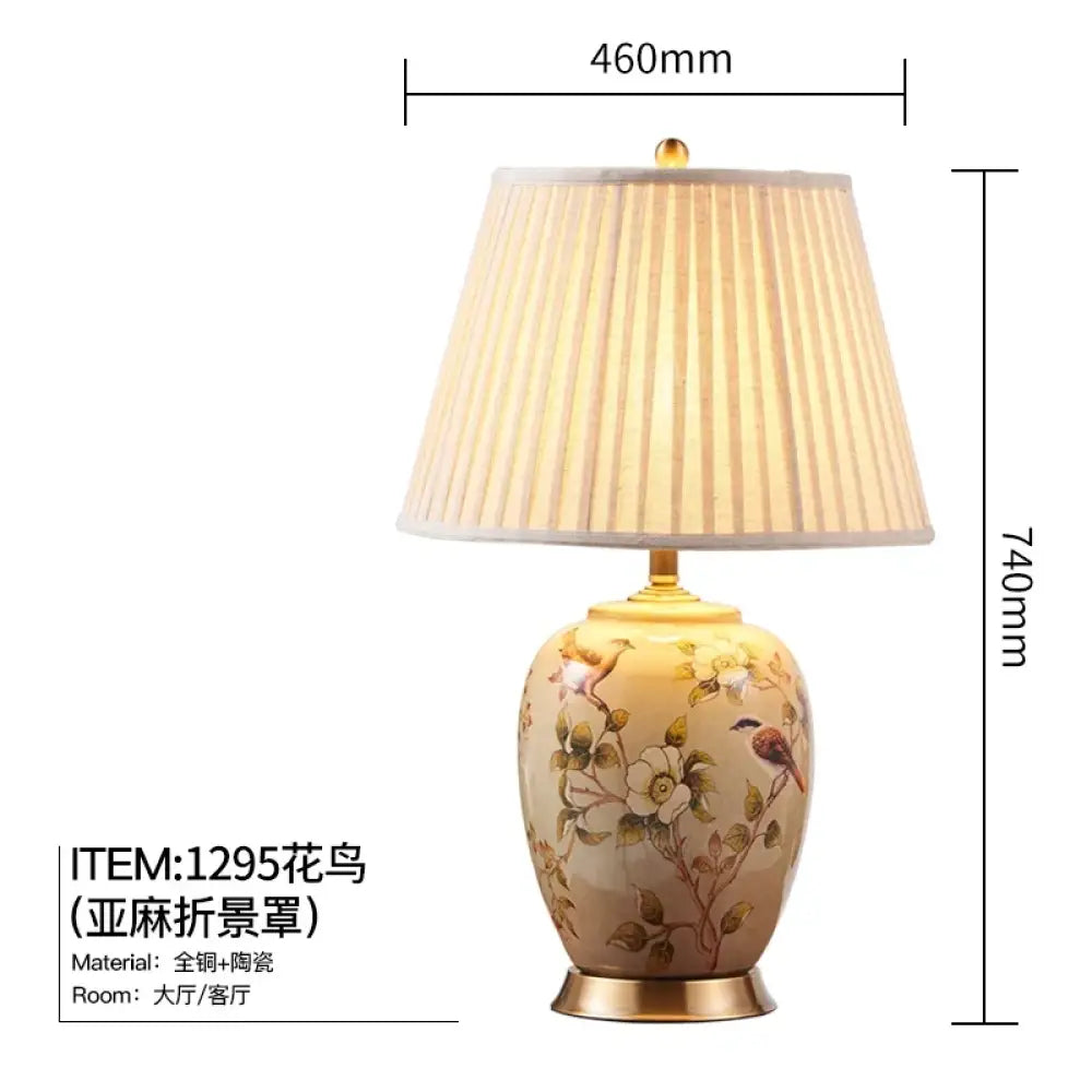 Ceramic table lamp with pleated fabric shade, floral bird design, shown with size guide