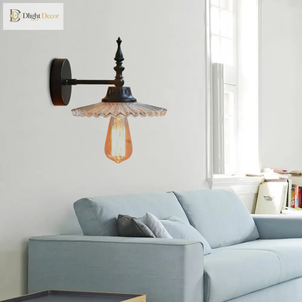 Light Up Your Space With Industrial Chic: The 1 - Light Black Sconce Clear/Green Glass