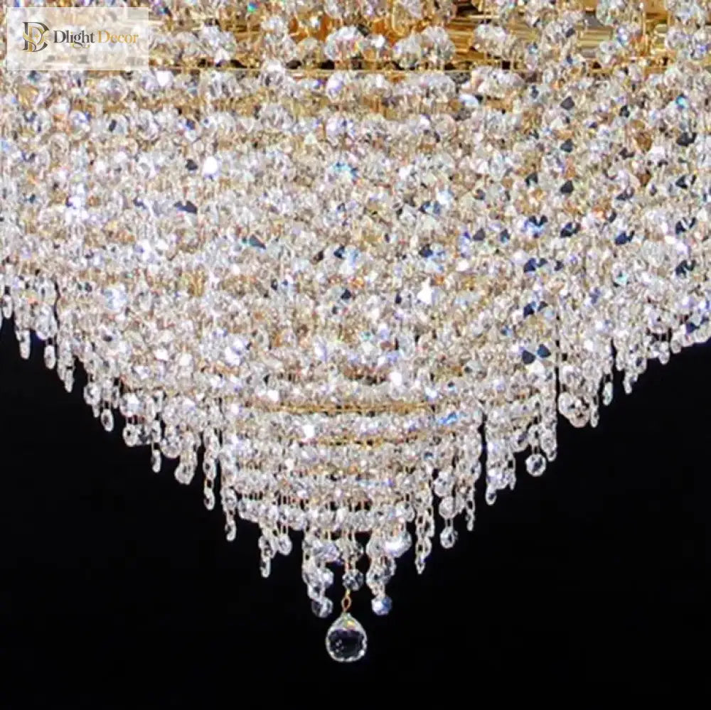 Ceiling chandelier detail: clear crystal drops and beads with gold-tone frame