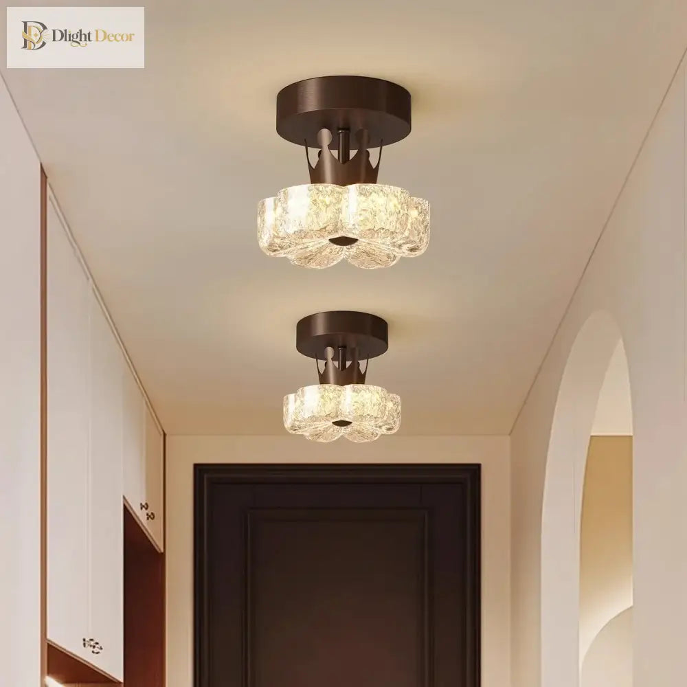 Brown flush-mount LED ceiling light with frosted glass shades in hallway ceiling