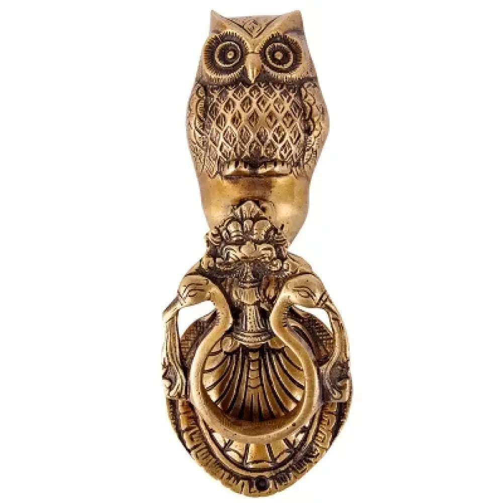 Victorian cast brass owl door knocker angled front view with curled feather and ring base