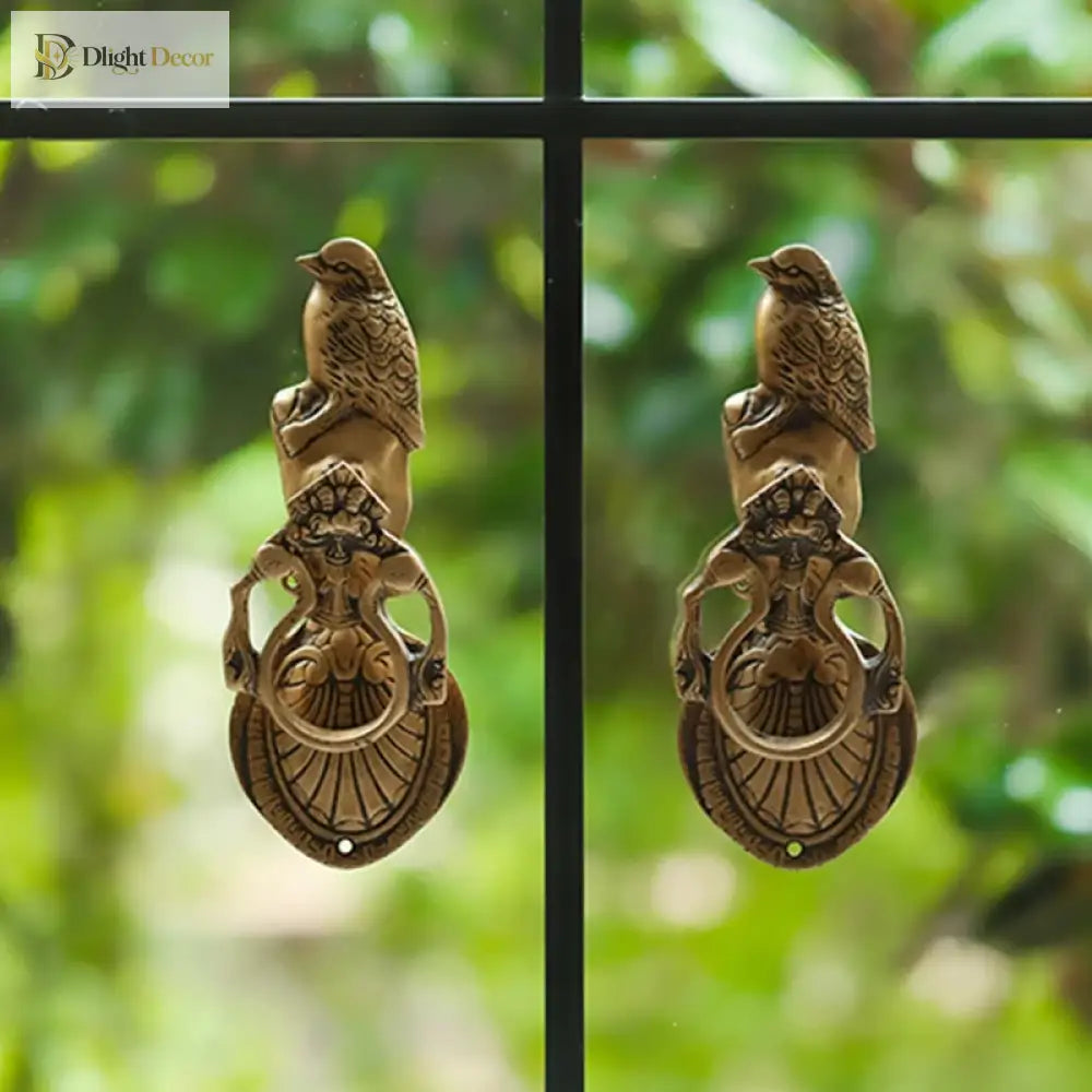 Victorian cast brass owl door knocker side profile with textured wing pattern and ring handle