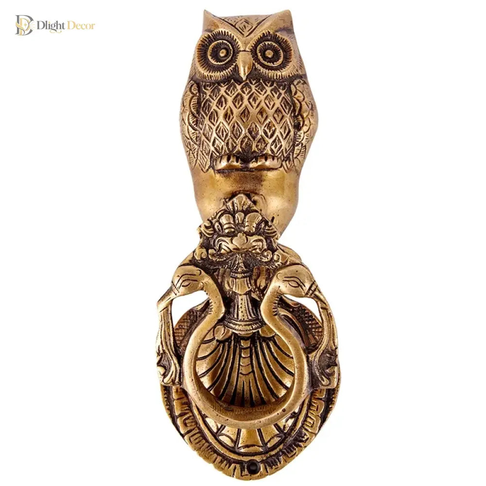 Victorian cast brass owl door knocker full front view with round eyes and sculpted feather details