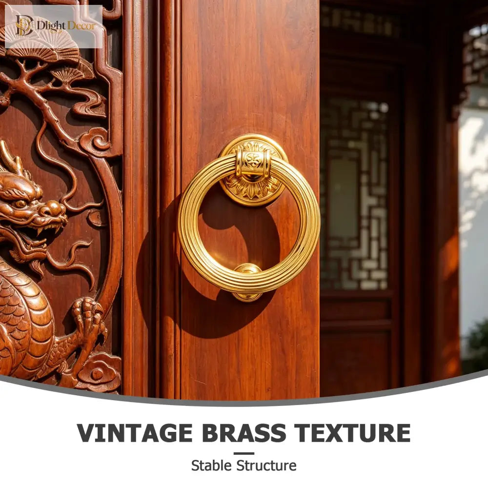 Round brass door knocker with coiled ring and engraved floral center on wood door