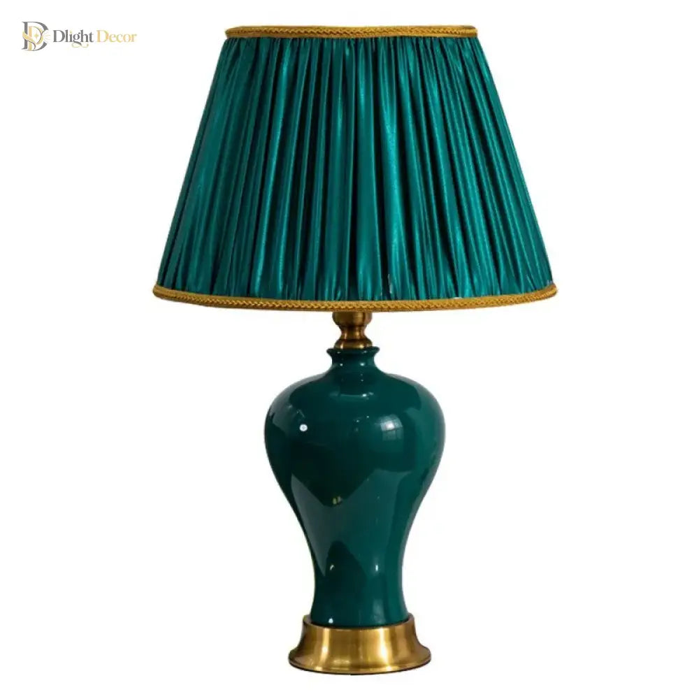 Teal ceramic LED desk lamp with pleated teal drum shade and gold base accents